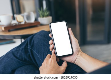 Cell Phone Mockup Blank White Screen.woman Hand Holding Texting Using Mobile On Desk At Coffee Shop.background Empty Space For Advertise.work People Contact Marketing Business,technology