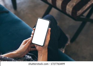 Cell Phone Mockup Image Blank White Screen.woman Hand Holding Texting Using Mobile On Desk At Coffee Shop.background Empty Space For Advertise.work People Contact Marketing Business,technology 