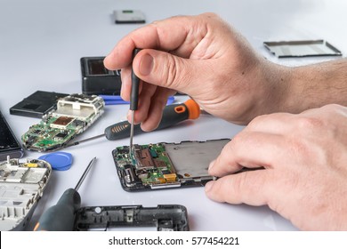 Cell phone repair. Smartphone parts and tools for recovery, selective focus