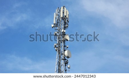 Cell phone telecommunication tower. Communication tower antenna on blue background. Antennas of mobile phone communication, television, internet, radio, on blue sky background. Beautiful 4K Footage.
