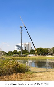 Cell Phone Tower Being Repaired With Very Tall Crane