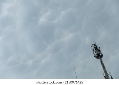 Cell Phone Transmission Tower Against A Background Of Storm Clouds.