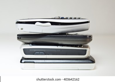 Cell phones stacked up against a white background.