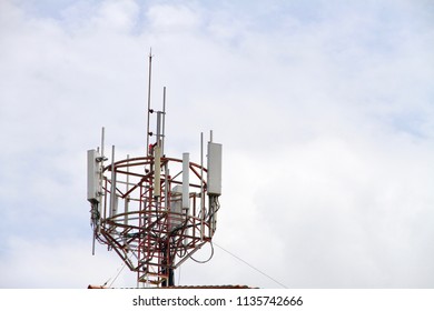 The Cell Site On The Rooftop With Cloudy Sky Background.