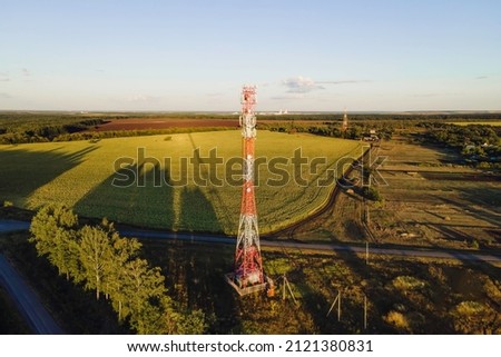 Cell site of telephone tower with 5G base station transceiver. Aerial view of telecommunication antenna mast