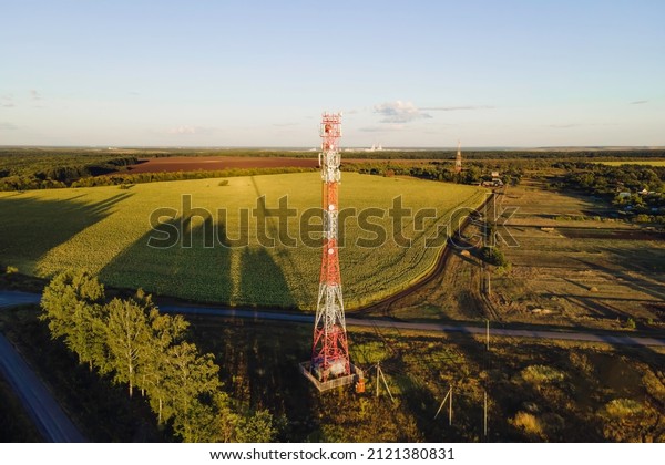 Cell site of\
telephone tower with 5G base station transceiver. Aerial view of\
telecommunication antenna\
mast