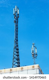 The cell tower with 3G, 4G and 5G communications. Base station for operating mobile phones, receiving and sending a signal. Antenna for wireless communication. Cellular systems in the city.