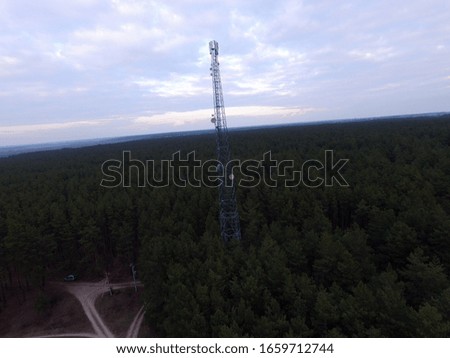 Cell tower in the forest, view from the drone. Near Kiev,Ukraine