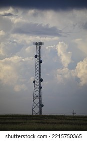 Cell Tower In Kansas Field As Storm Clouds Form.