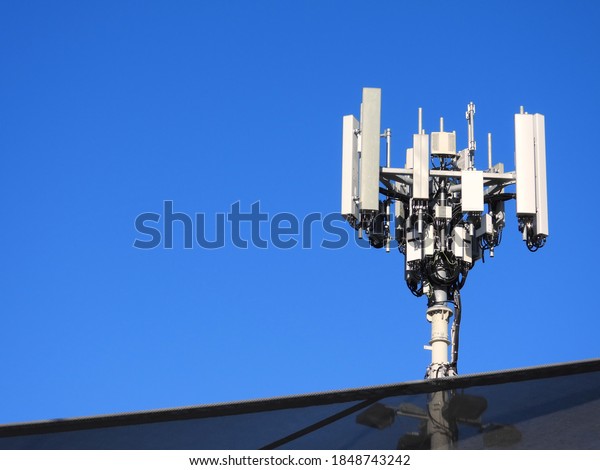 Cell Tower - Mobile Tower - Through a Car Park Shade\
Sail - Blue Sky 