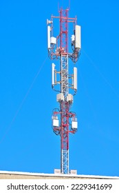 Cell tower on the roof of the building close-up - Shutterstock ID 2229341699