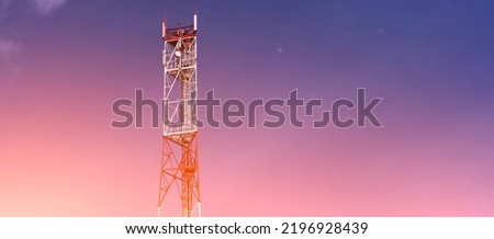 Cell tower on sunset sky background. Technology 5G network