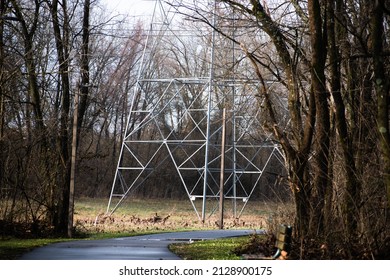 Cell Tower In Open Field With Trees