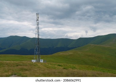 Cell Tower And Storm Clouds In Green Mountains