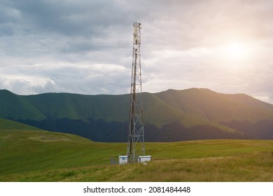 Cell Tower, Storm Clouds And Sun In The Mountains