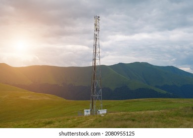 Cell Tower And Storm Clouds And Sunset In The Mountains