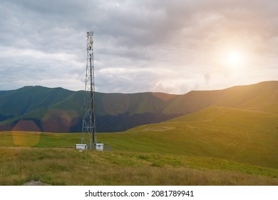 Cell Tower And Storm Clouds And Sunset In The Mountains