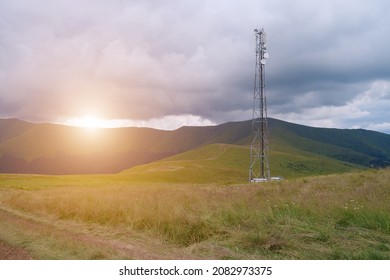 Cell Tower And Storm Clouds And Sunset In The Mountains