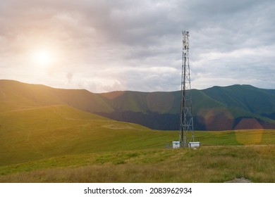 Cell Tower And Storm Clouds And Sunset In The Mountains