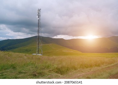 Cell Tower, Storm Clouds And Sunset In Beautiful Mountains