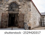 Cellblock I barred doors of Eastern State Penitentiary historic site.