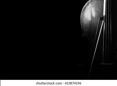 Cello on a black background. Stringed instrument