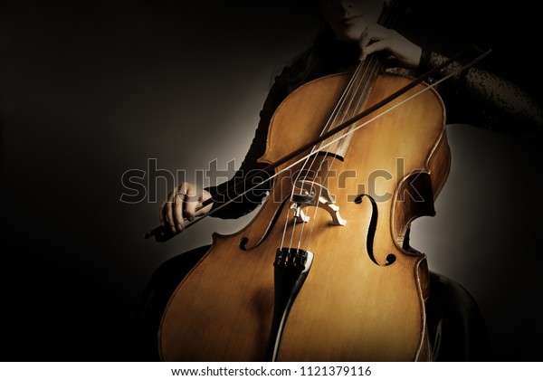 Cello player. Cellist hands playing
violoncello orchestra music instrument
closeup
