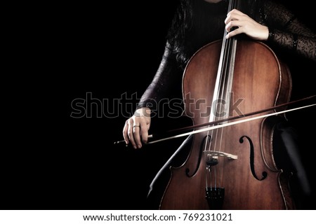 Cello player. Cellist playing cello hands with bow Orchestra music instrument close up