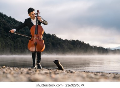 Cello Player Performing Outdoors At Sunrise