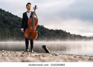 Cello Player Performing Outdoors At Sunrise