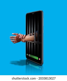Cellphone addiction jail technology slave - Shutterstock ID 2033813027