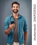 Cellphone, smile and portrait of man in studio, communication and social media on gray background. Internet, online and scroll for texting on dating app, talk or happy male person on mobile for love