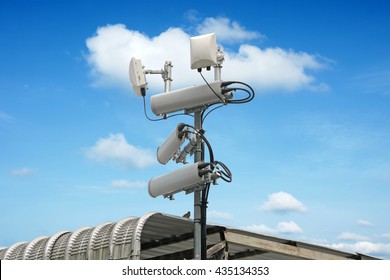 Cellular Network Antenna With Wifi Hotspot Repeater And Blue Sky.