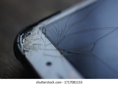 Cellular Phone With Cracked Screen. Smartphone With Cracked LCD Screen