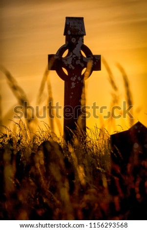 Celtic cross at sunset