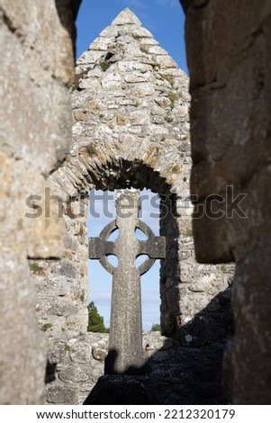 Celtic cross in window of Clonmacnoise monastery