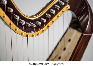 Celtic gray irish harp, classical and traditional string music instrument, isolated white background, close-up