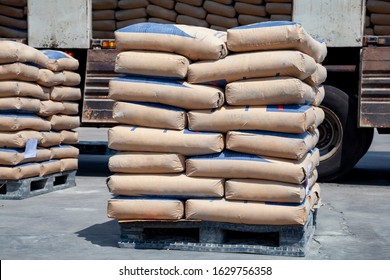 Cement bags are placed on pallets and stored in warehouses, Cement bags for construction, Cement industry  business.