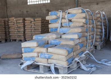 Cement bags in a row on the Palace in the shed