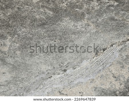The cement floor has cracks.