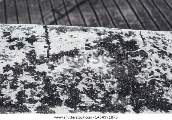 Cement\
floor and wall Of the top floor parking lot as an outdoor deck That\
is old is a background with a pattern of mold And the walls of the\
plaster have old mold stains Abstract\
pattern.