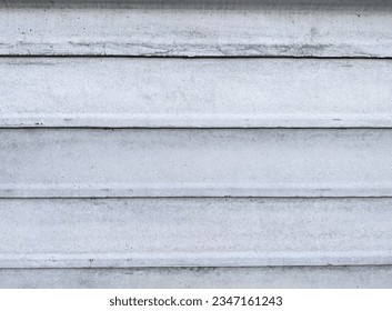 Cement sheets are placed horizontally to form a wall.