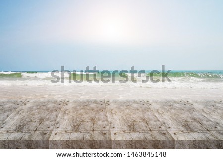 Similar – two straw beach umbrellas on an empty seashore on a clear day