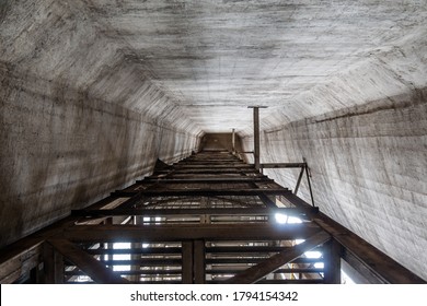 The Cement Silo Represents Data Silos In Computer Science, Which Isolates Data, Since The Only Access Door To The Data Is A Single Application