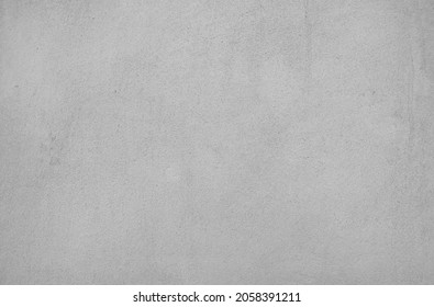 Cement wall background, not painted in vintage style. Smooth concrete for wallpaper or graphic design. Blank plaster texture in retro concept. Modern house interiors that feel calm and simple.