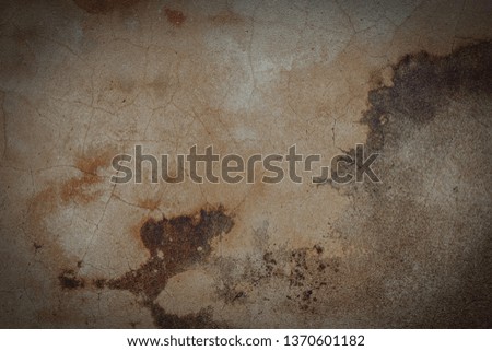 cement wall has cracks for Vignetted texture background. 
The surface of the old gray concrete. Space for entering text.