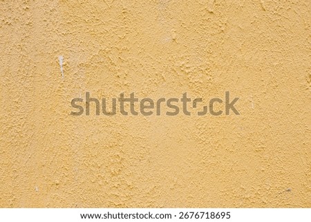 Cement wall with rough light brown plaster.Wall With Shabby Plaster