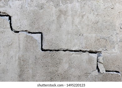 Cement Wall With A Stair Crack On It. 