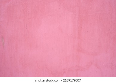 cement wall texture. pink background texture. wall paper shape and have copy space for text. Abstract colorful wall texture and background. Old textured concrete wall with natural defects. 