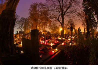 Cemetary Decorated With Candles For All Saints Day At Night